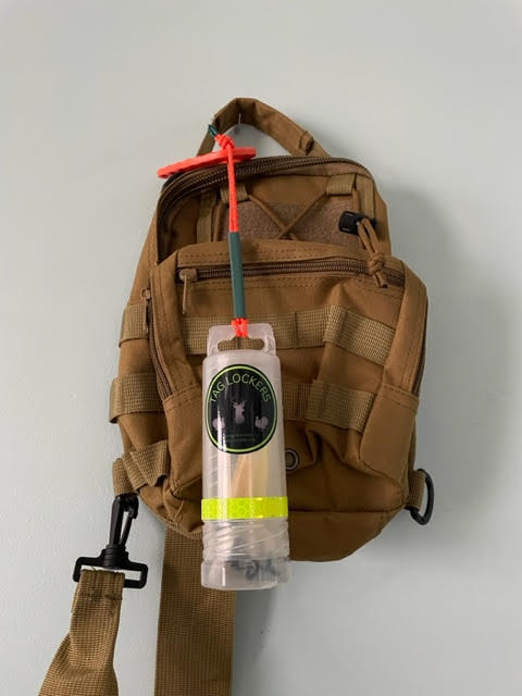 TagLocker 1.5 with an orange carabiner and a Tan shoulder bag!