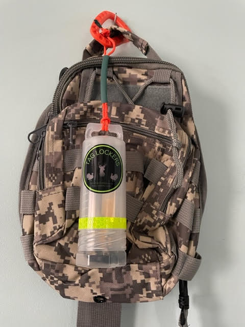 TagLocker 1.5 Inch with orange carabiner and a Digital Camo Bag